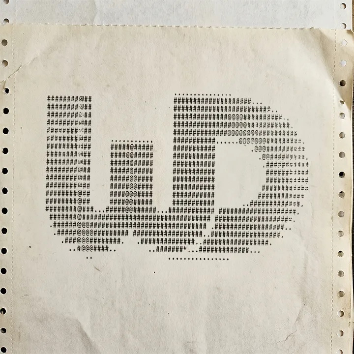 A large WD logo rendered in monochrome ASCII art using characters like hashtags and symbols, printed on continuous-feed computer paper with perforated edges.